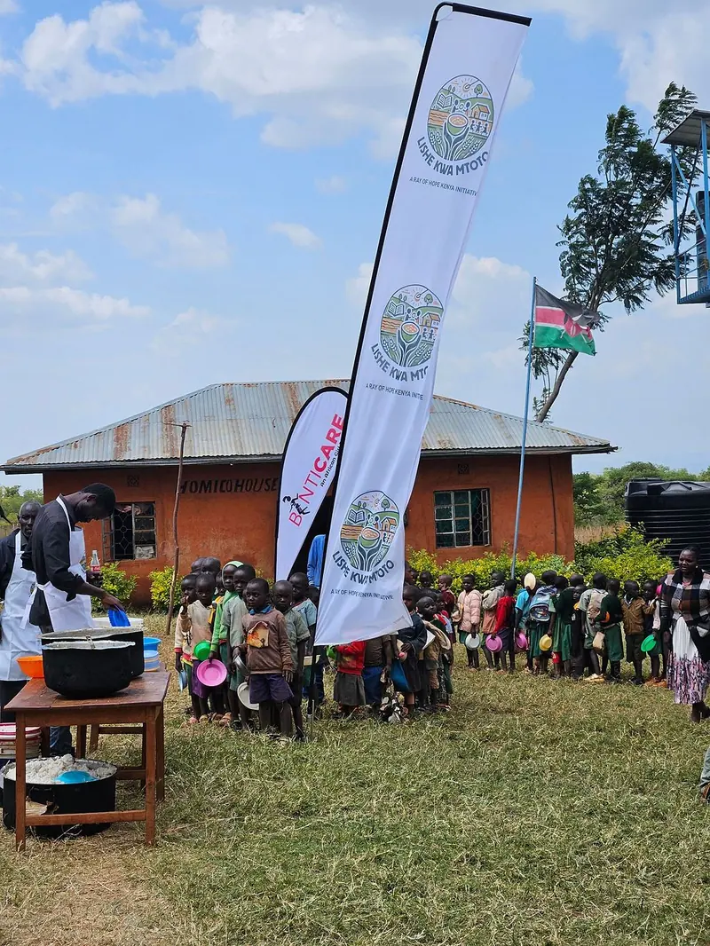 Children lining up for a Lishe Kwa Mtoto school meal