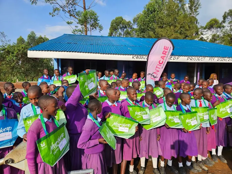 Girls celebrating with their dignity kits at a BintiCare outreach day