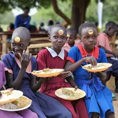 Children enjoying their school meal together