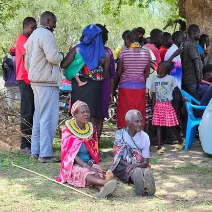 Community members gathered for a Lishe Kwa Mtoto distribution in the ASAL region